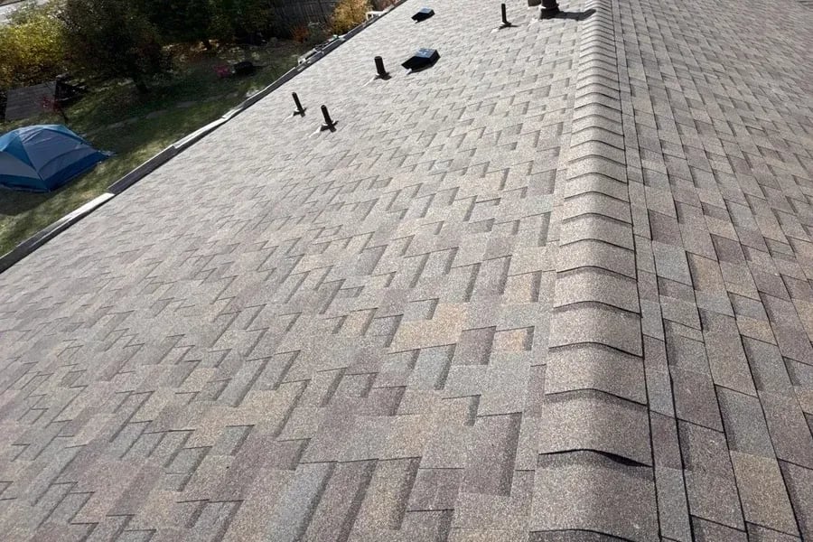 Brown blend architectural shingle roof ridge with roof vents