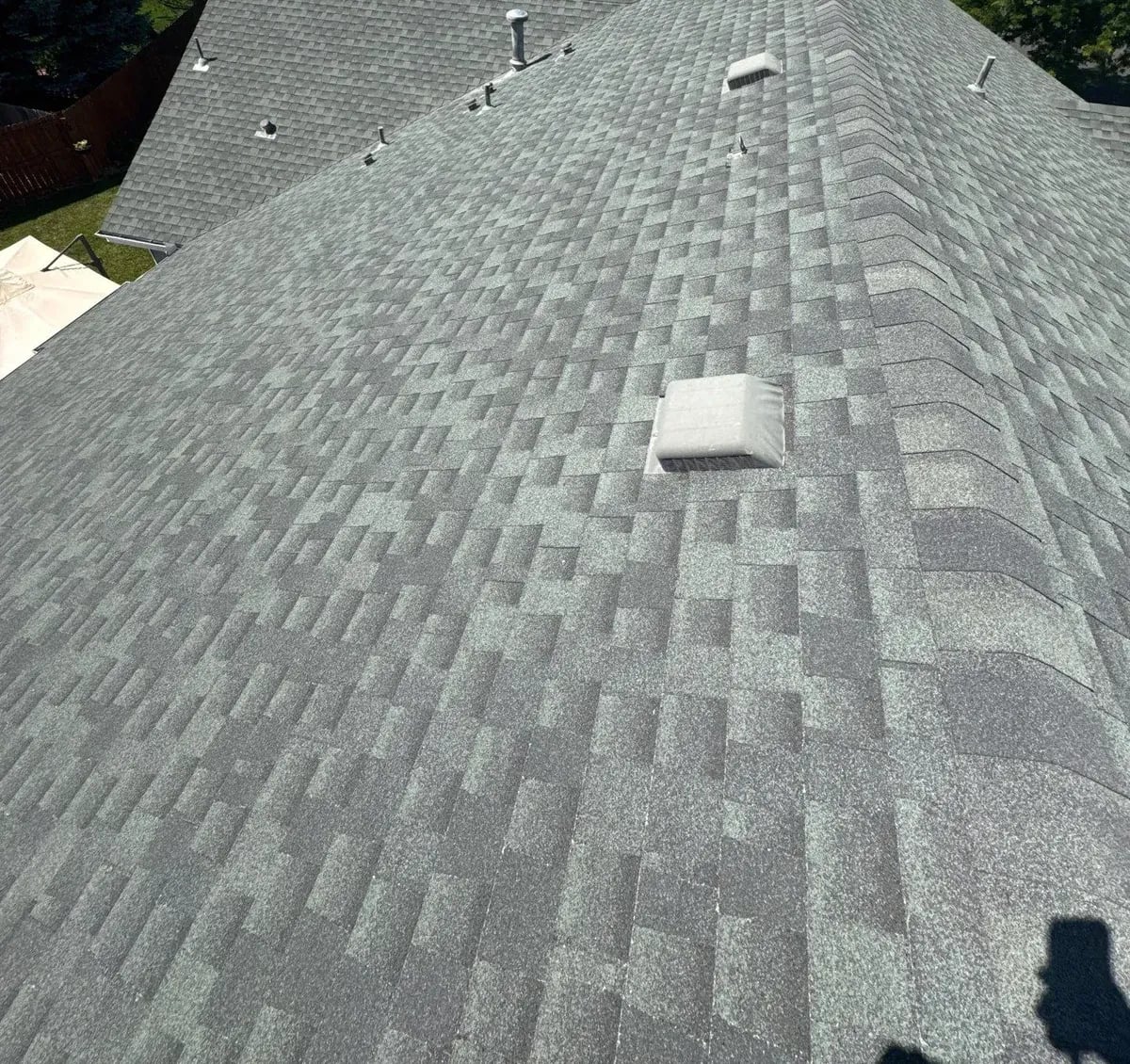 Gray green architectural shingle roof with box vents