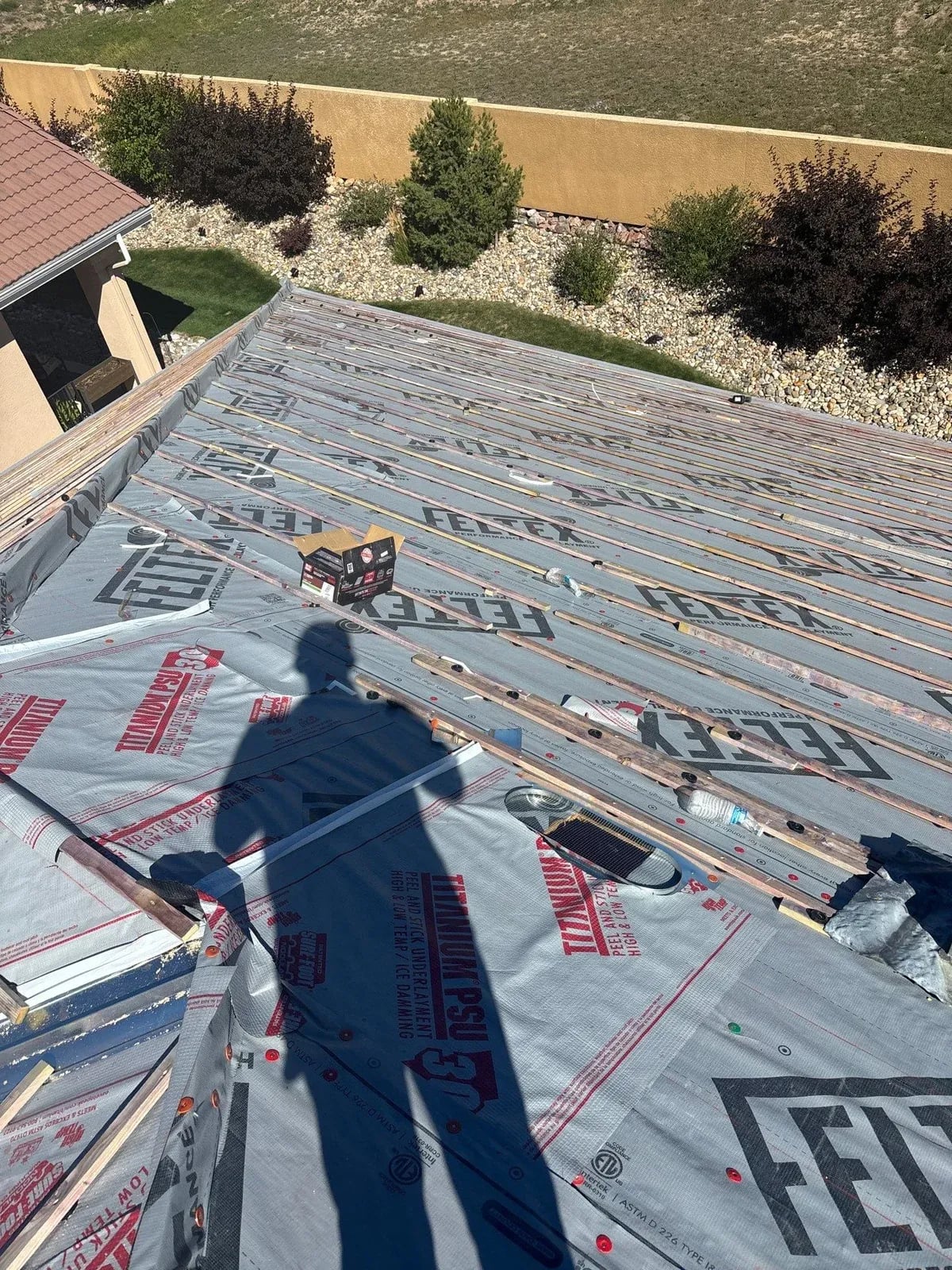New underlayment installed on a roof deck before tile goes on